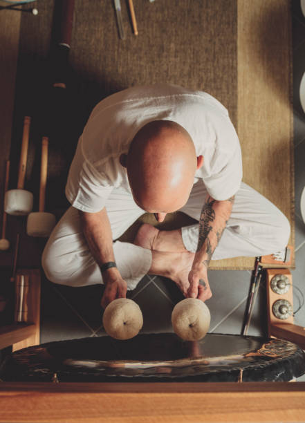 Adult man playing gong stock photo