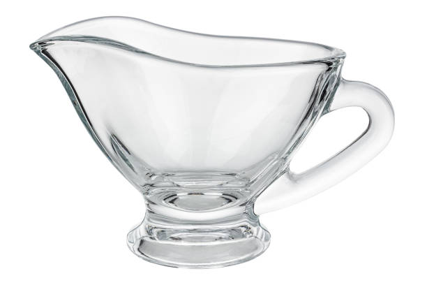 istock Empty transparent glass gravy boat isolated on white background 1217454970