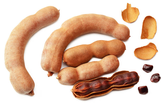 istock fresh tamarind fruits isolated on white background. top view 1217455888