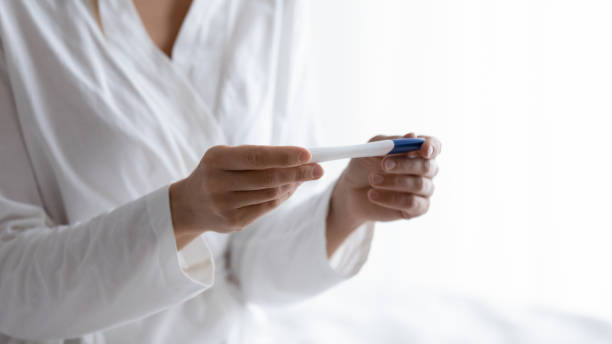 istock Close up quick plastic pregnancy test in female hands. 1217456126