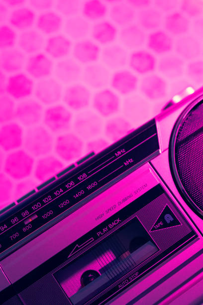 A vintage boombox lit with a 80's / 90's neon light
