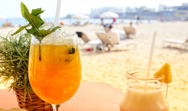 istock Fresh cocktails served on the table with lovely view on the beach. 1217457874