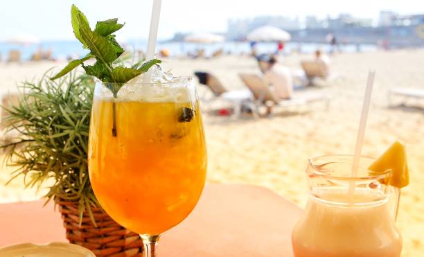 istock Fresh cocktails served on the table with lovely view on the beach. 1217457879