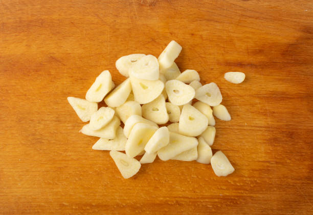 istock Fresh Garlic Parts Isolated on White Background 1217461578
