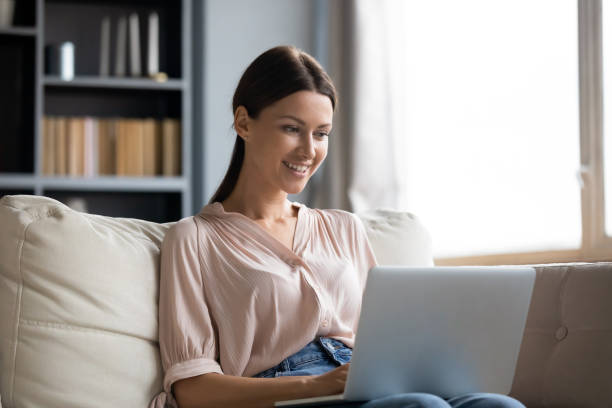 istock Happy attractive young woman e-dating online on computer. 1217463814
