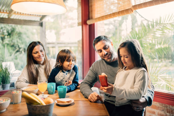istock Family with two kids eating breakfast together 1217469997