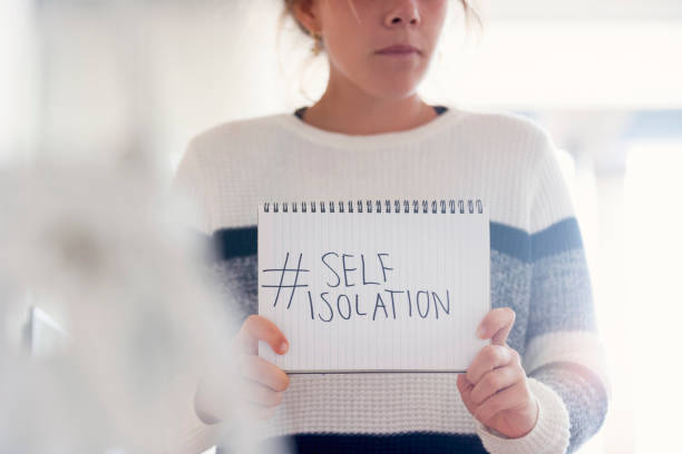 istock Woman holding a #selfisolation sign. 1217472338
