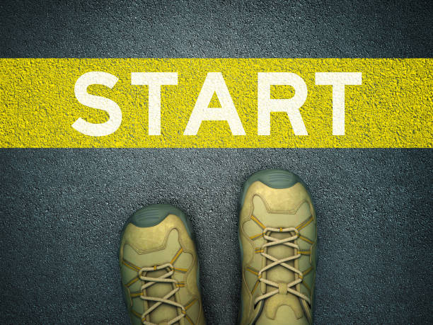 istock Feet on Asphalt Road with START Word - 3D Rendering 1217473656