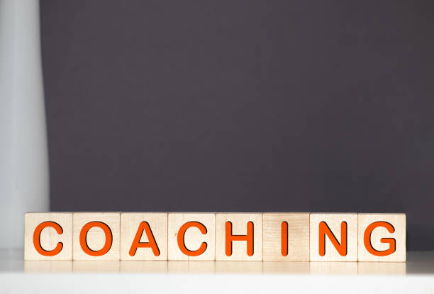 istock coaching word on a wooden blocks 1217475171