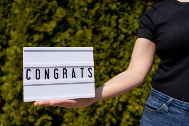 istock Woman holding sign writing 