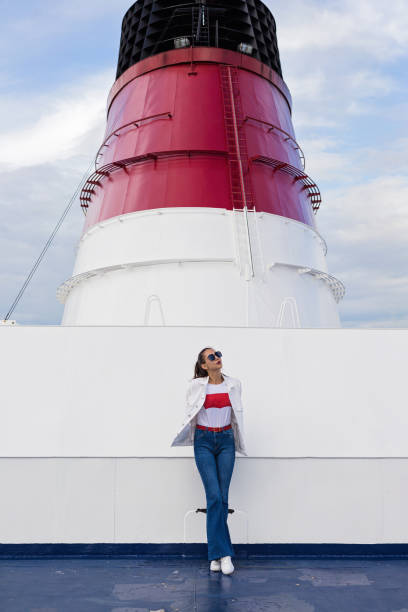 Ferry chimney with exhaust pipes on the background of blue sky