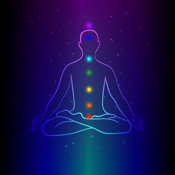 istock Meditating human silhouette with chakra signs. Practicing meditation. Yoga lotus pose, asana padmasana. Vector illustration. 1217477608