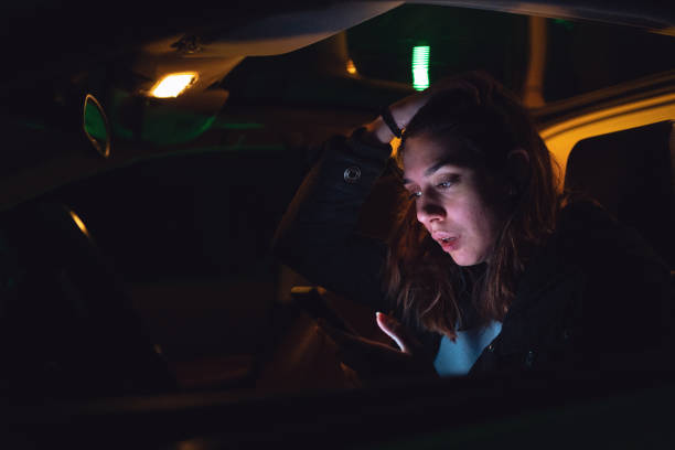 istock Woman crying in her car while using a mobile phone 1217478463