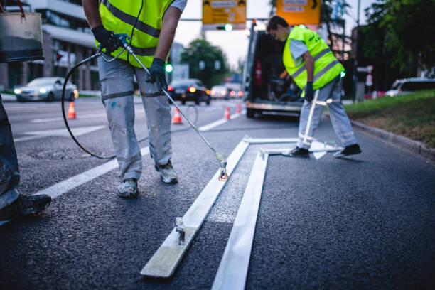 istock Workmen Providing Road Marking Maintenance at Dusk 1217480476