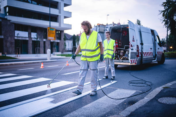istock European Civil Engineering Crew Repainting Zebra Crossing 1217480523