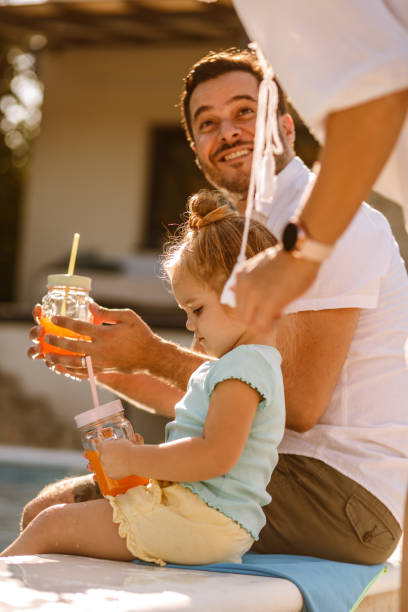 istock Father and daughter with mason jars 1217480590