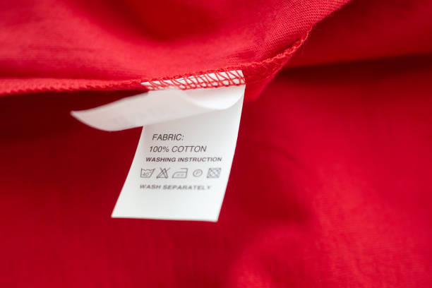 istock White laundry care washing instructions clothes label on red cotton shirt 1217480596