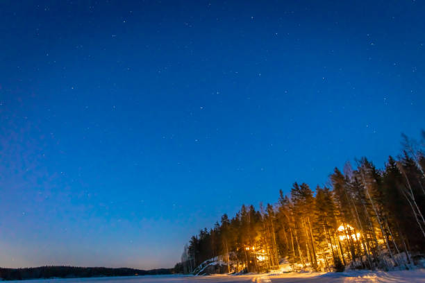 istock Lake house in winter night 1217481555