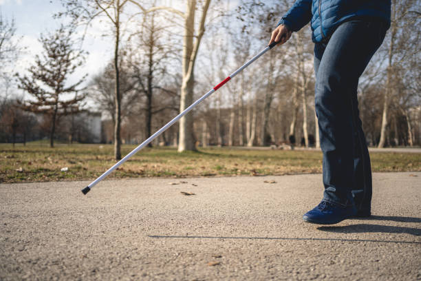 istock Blind man guiding himself with a help of a walking cane 1217483882