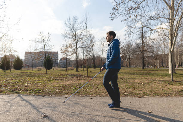 Blind man enjoying a warm spring day at a park
