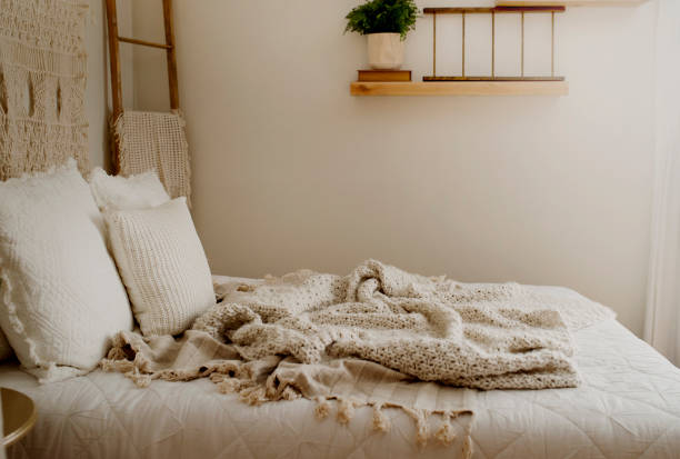 istock Queen Bed Layered with Neutral Duvet and Comfy Throw Blankets 1217491043