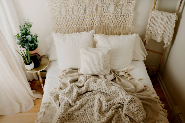 istock Queen Bed Layered with Neutral Duvet and Comfy Throw Blankets 1217491044