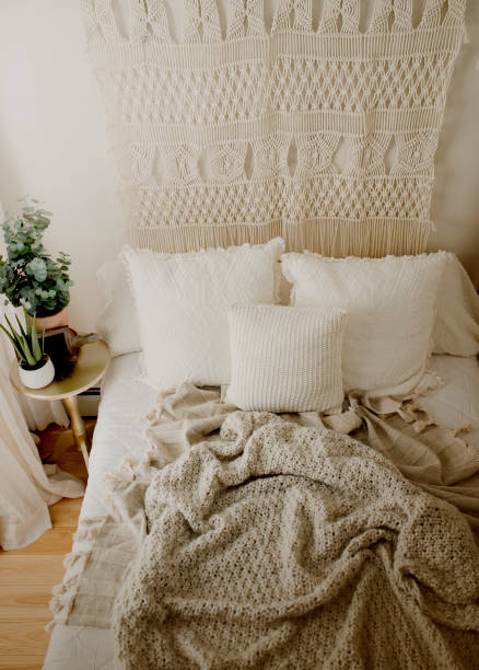 istock Queen Bed Layered with Neutral Duvet and Comfy Throw Blankets 1217491049