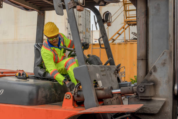 istock industial background of african american forklift driver driving forklift a loading area at containers yard and cargo 1217500176