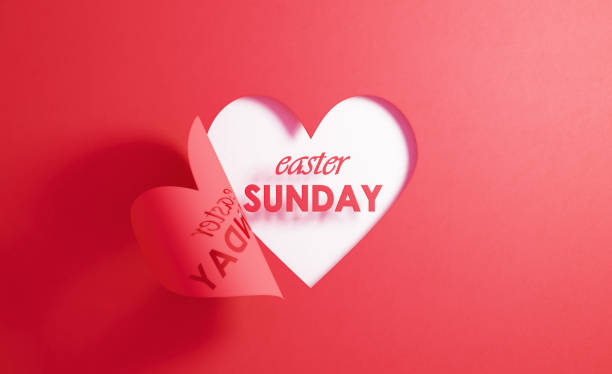 istock Easter Sunday Concept- Easter Sunday Written Inside Of A Red Folding Heart Shape On White Background 1217502924