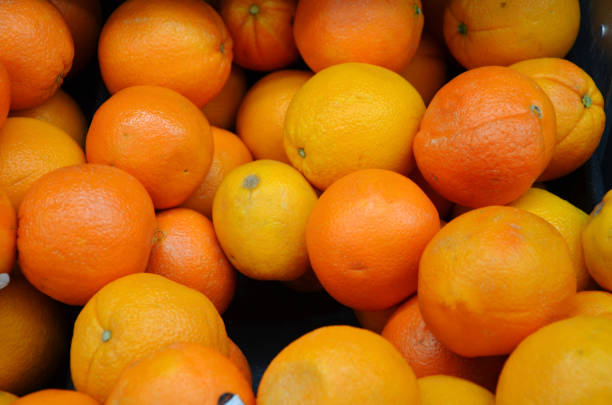 istock Grocery store display of oranges 1217502986