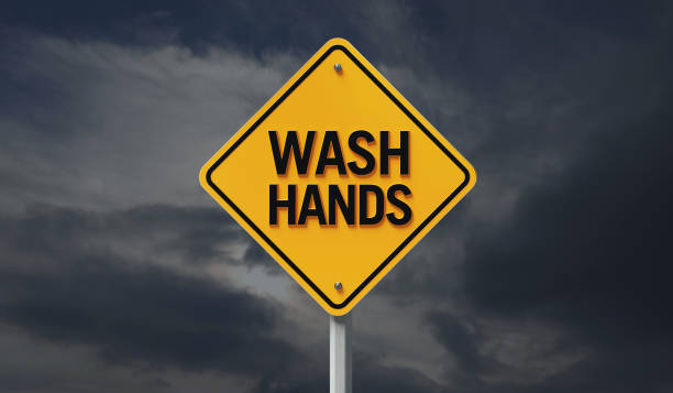 istock Yellow Off Road Traffic Sign with Wash Hands Text on Cloudy Sky 1217504784