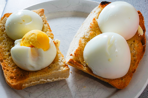 Hard boiled eggs on buttered toast