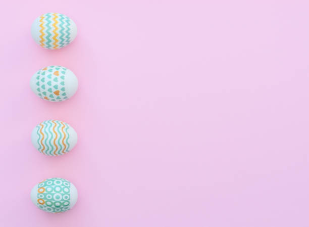 istock Decorated Easter eggs lie on the pink background. Happy Easter holiday concept. Greeting, invitation card. Flat lay style with copy space. 1217510390