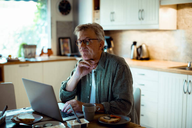 istock Mature man working from home 1217512501