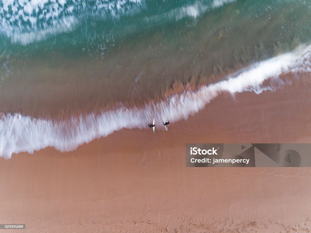 Surfer at Curl Curl Beach, Sydney Australia aerial Australia Stock Photo