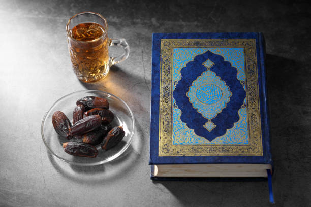 istock dates fruit and Islamic Book Koran on a concrete background, Islamic background in Ramadan 1217517598