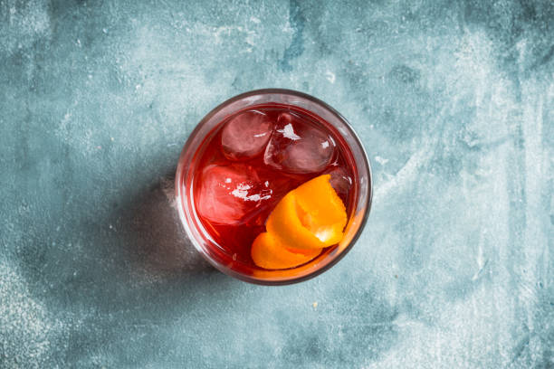 istock Red traditional old fashioned cocktail with orange zest on the rustic background 1217517670