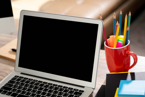 istock Laptop with blank screen on table. Workspace background new project on laptop computer with blank copy space screen for your advertising text message 1217518627