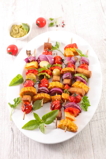 istock vegetarian barbecue party with corn, tomato, onion, tofu 1217518893