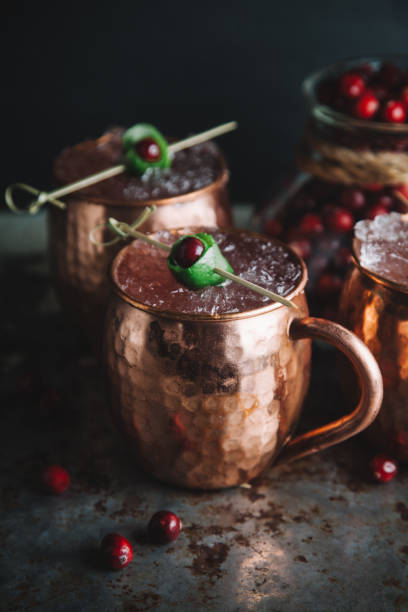 istock Moscow Mule cocktails garnished with cranberries and lime 1217520537