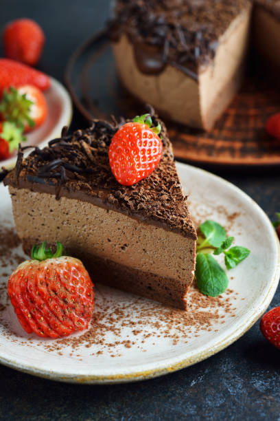 istock Chocolate mousse cake decorated with strawberries 1217520547