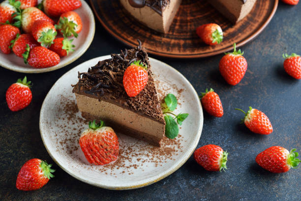 istock Chocolate mousse cake decorated with strawberries 1217520588