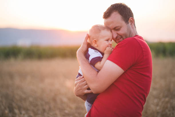istock Happy father and son in the summer fields 1217522742