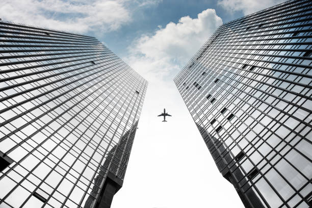 istock The plane flew through two symmetrical city buildings 1217524731