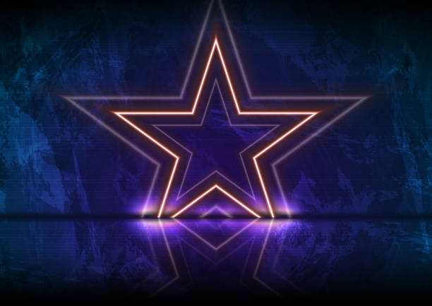 istock Orange neon luminous stars on grunge wall background 1217525009