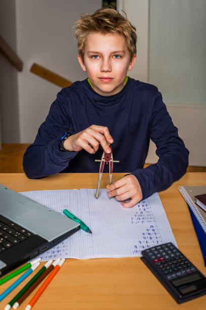 istock teenager doing  homework in mathematics 1217531111