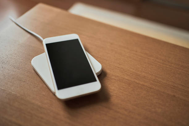 istock Smart phone charging on the wireless charger 1217535700