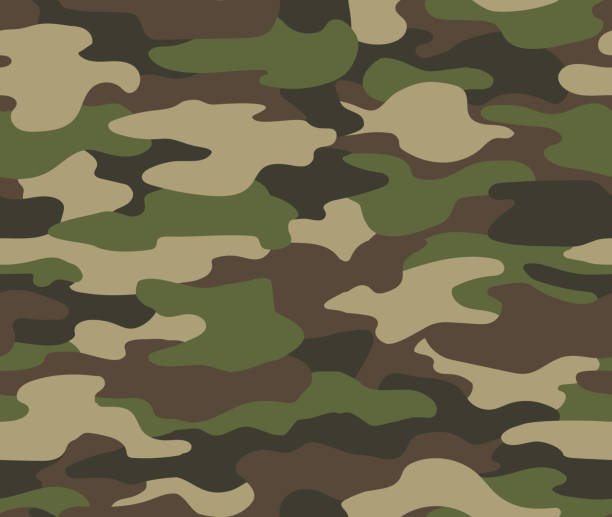 istock Camouflage seamless pattern. Abstract military or hunting camouflage background. Classic clothing style masking camo repeat print. Green brown black olive colors forest texture camouflage 1217537175