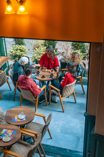 istock Friends drinking coffee and turkish tea in cafe 1217538048