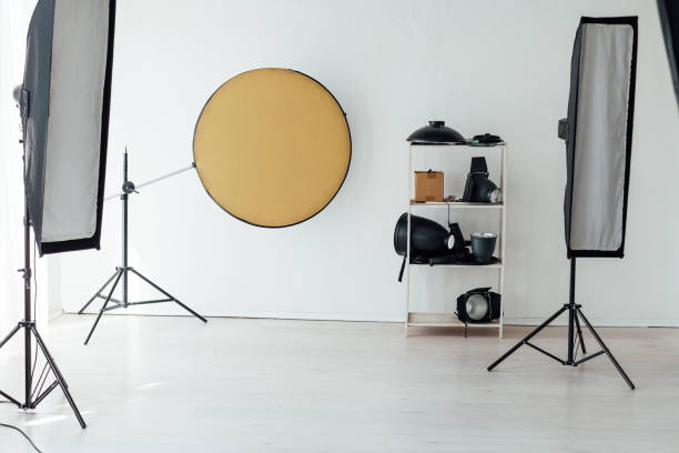 istock Photo studio accessories photographer flash white room 1217539042